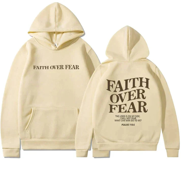 Model wears a stylish unisex 'Faith Over Fear' hoodie. Comfortable Christian apparel with Psalm 118:6 scripture.