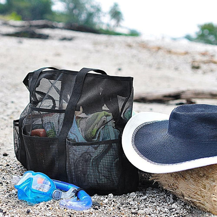 Spacious mesh beach tote bag with 9 pockets, ideal for carrying essentials to the beach or pool.