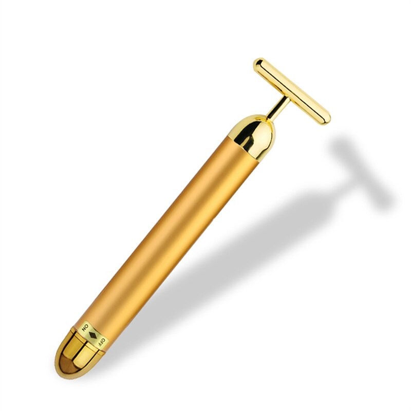 Unisex gold facial roller & massager for radiant, youthful skin & anti-aging benefits.