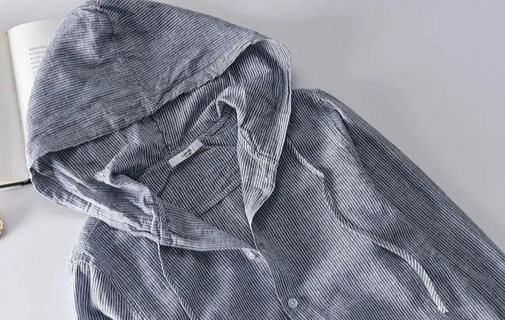 Unisex hooded shirt in lightweight fabric, showcasing breathable material and casual design with versatile unisex fit.