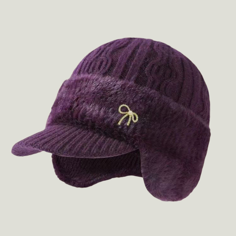 Versatile unisex winter hat, knit trapper cap with secure ear flaps for all outdoor fun.