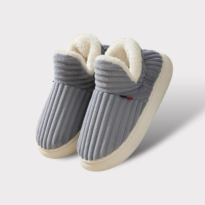 Cozy ergonomic indoor slippers. Ultra-warm plush footwear, anti-slip sole for ultimate comfort & relaxation.