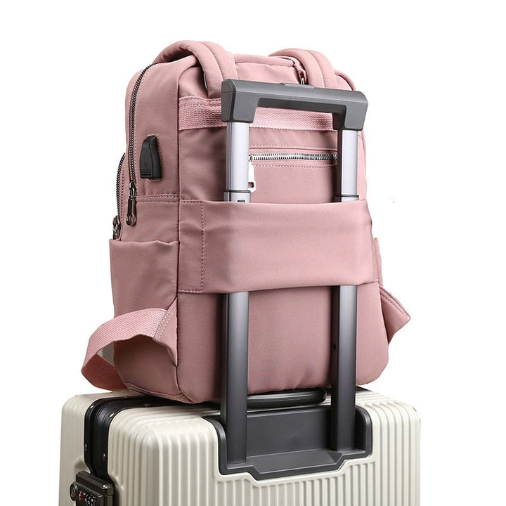 Unisex water-resistant anti-theft backpack with USB charging port. Sleek, durable design for daily use.
