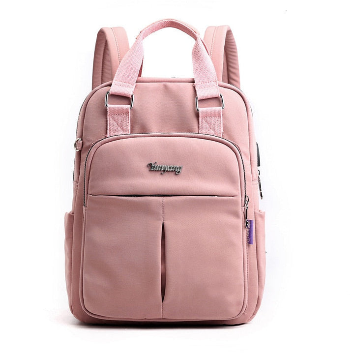Durable, water-resistant anti-theft backpack in an outdoor setting. Features USB charging & secure compartments.