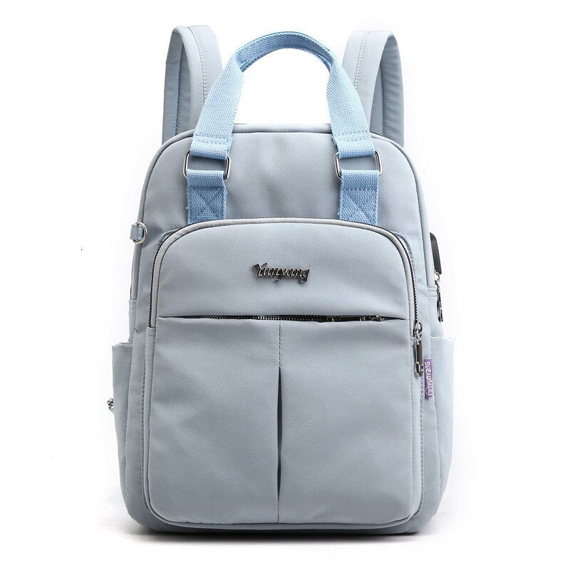Commuter wearing a sleek, water-resistant anti-theft backpack with USB charging, perfect for daily travel.