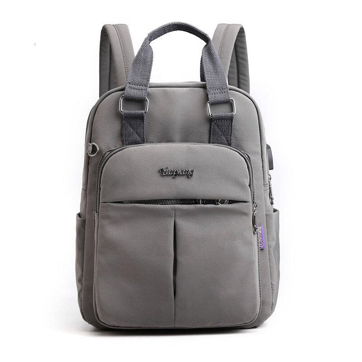 Unisex traveler with a multi-compartment anti-theft backpack. Water-resistant, USB charging, ideal laptop bag.