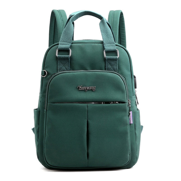 Close-up of secure anti-theft zippers on a durable, water-resistant USB charging multi-compartment backpack.