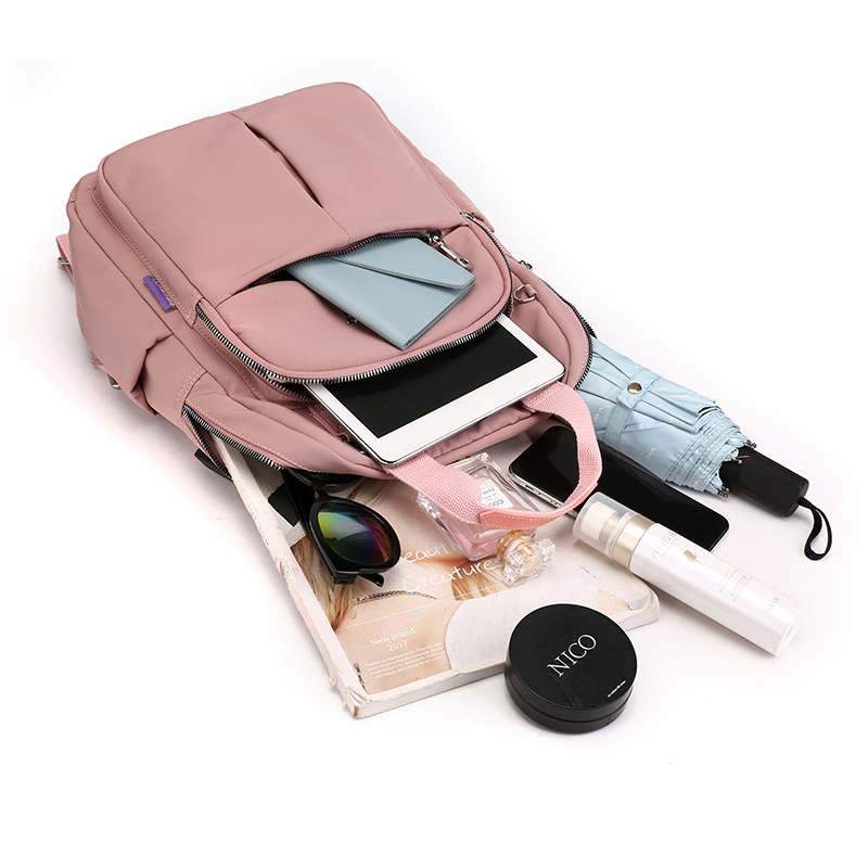 Detail of the durable, water-resistant fabric on the anti-theft USB charging multi-compartment backpack.