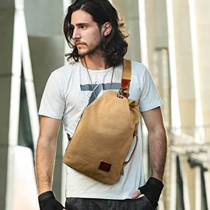 Durable multiwear canvas sling bag with secure anti-theft pocket, ideal for everyday essentials.
