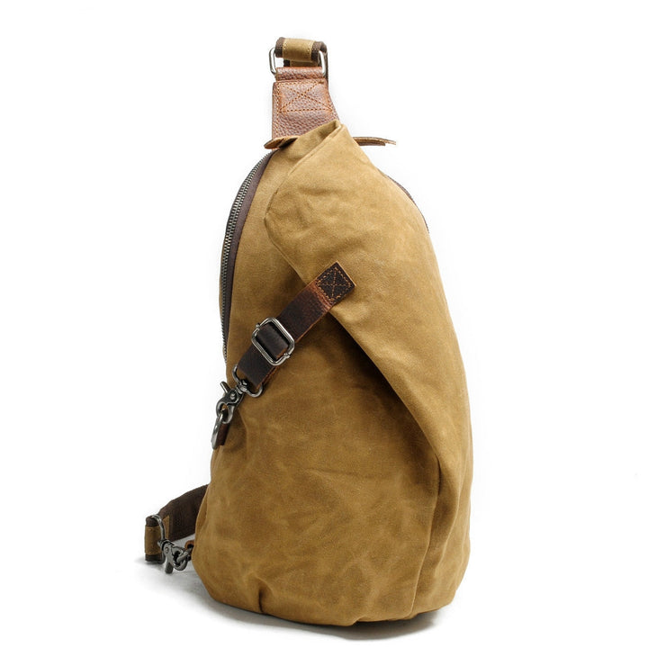 Water-resistant canvas shoulder bag with a secure anti-theft pocket, ideal for daily and travel use.