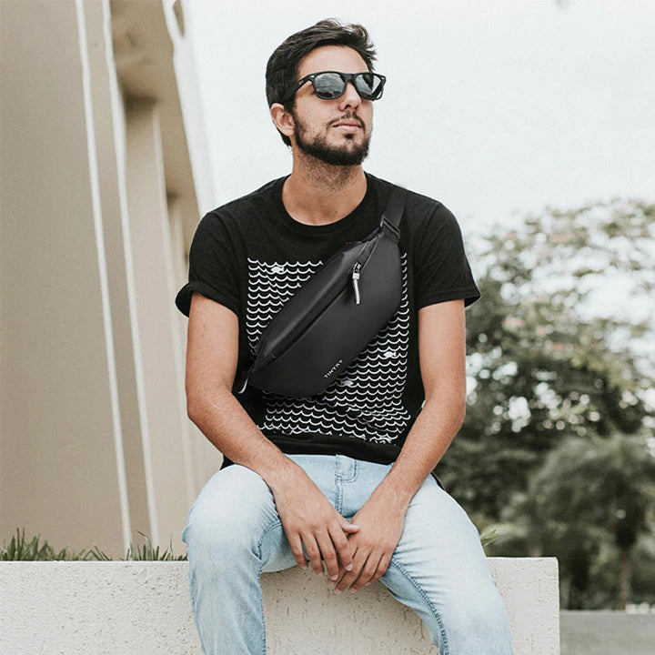 Hands-free water-resistant waist bag, ideal for secure travel, exploring cities, or airport essentials.