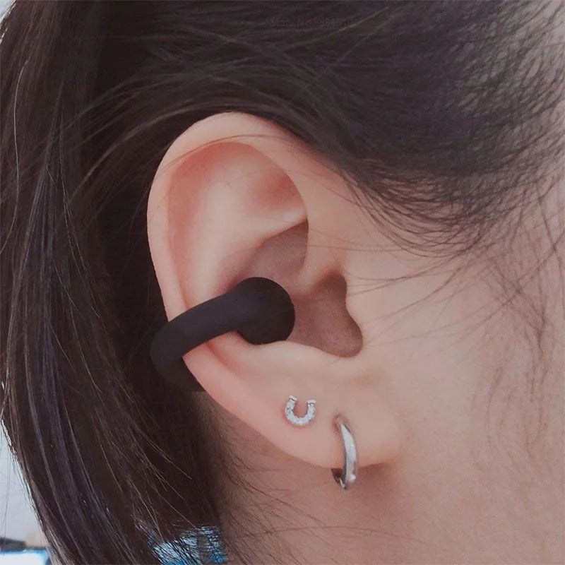 Unisex wireless bone conduction earphones, open-ear design for sports & running. Bluetooth, water-resistant & comfortable.