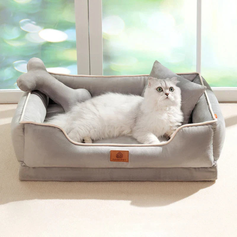 "Velvet-soft pet bed with cushion and bolster, shown in modern living room, offers comfort with Dutch velvet texture."