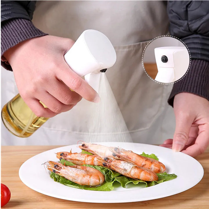 "Versatile refillable oil spray bottle, transparent body, fine mist spray, eco-friendly plastic, ideal for home chefs and coo