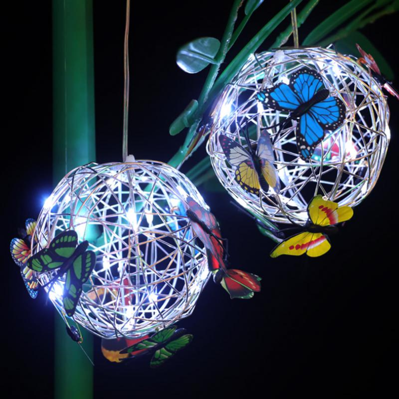 Decorative solar LED butterfly garden light illuminates patios & yards. Eco-friendly, waterproof outdoor ambiance lighting.