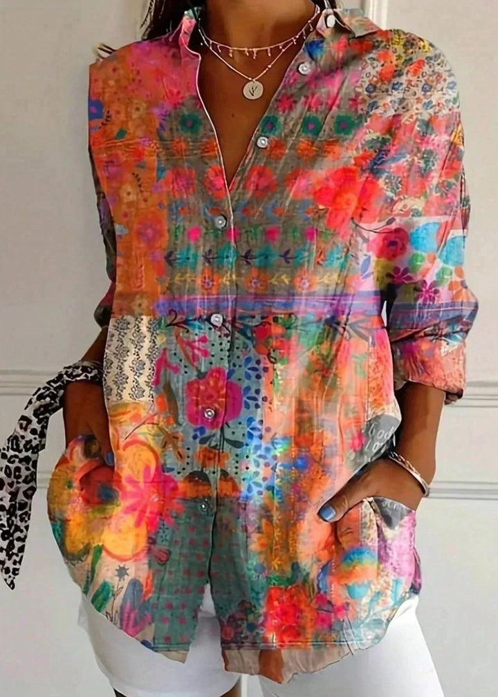 Elegant women's vibrant abstract print long sleeve blouse. Fashionable and colorful top.