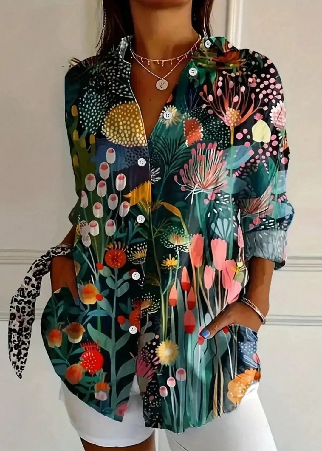 Casual women's vibrant printed long sleeve shirt. Comfortable and stylish top for everyday wear.
