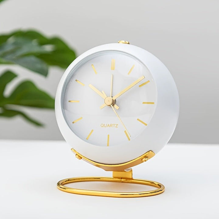 Elegant metal vintage analog desk clock with a classic loud alarm, enhancing retro bedroom decor.