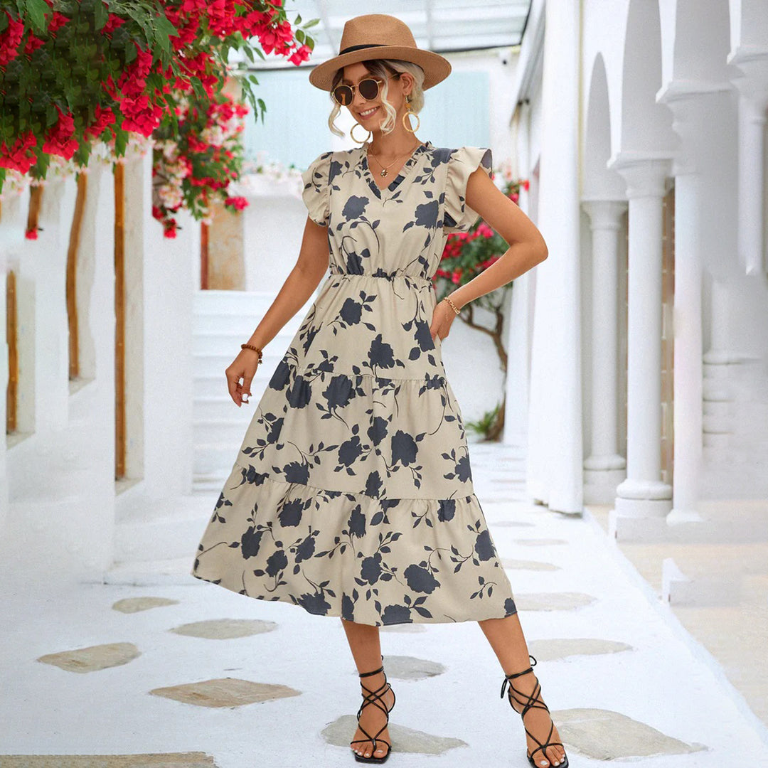 Vintage black V-neck midi dress for women, featuring elegant floral print, perfect for summer outings.