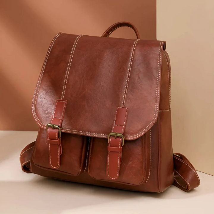 Brown vintage backpack with leather accents. Perfect durable RetroTrail bag for school, work or travel.