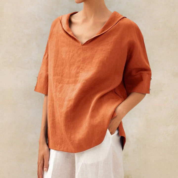 "Visual of a Women's V-Neck Linen Blouse, relaxed fit, elbow sleeves, breathable fabric, ideal for elegant, casual occasions.