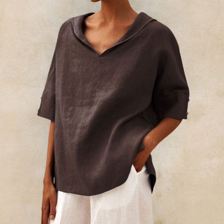 "Visual of a Women's V-Neck Linen Blouse, relaxed fit, elbow sleeves, breathable fabric, ideal for elegant, casual occasions.