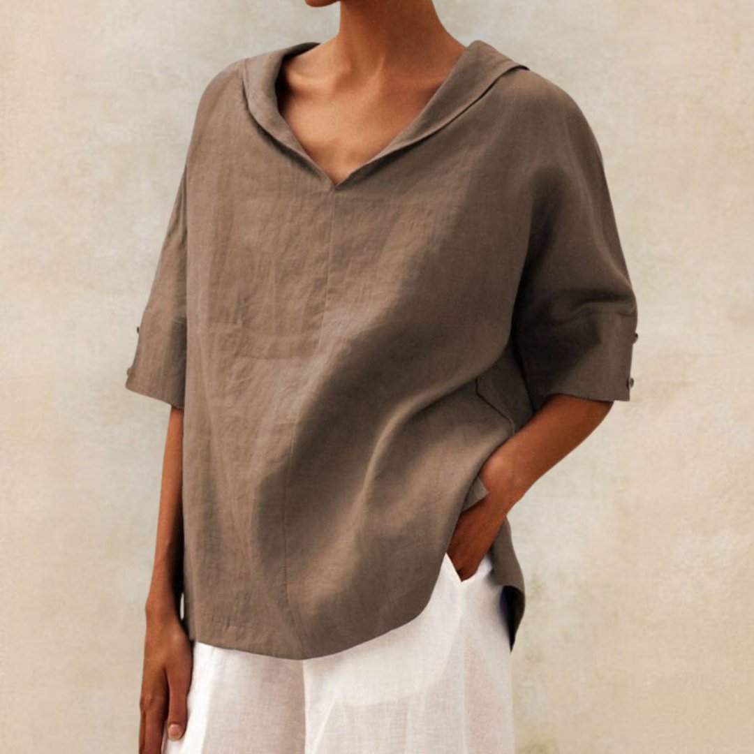 "Visual of a Women's V-Neck Linen Blouse, relaxed fit, elbow sleeves, breathable fabric, ideal for elegant, casual occasions.