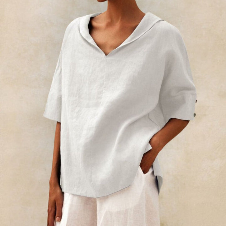 "Visual of a Women's V-Neck Linen Blouse, relaxed fit, elbow sleeves, breathable fabric, ideal for elegant, casual occasions.
