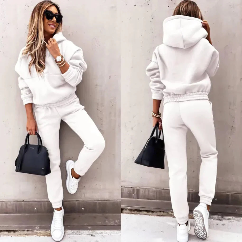 Women's cozy winter tracksuit jacket featuring a full zip and comfortable cuffs, ideal for layering.