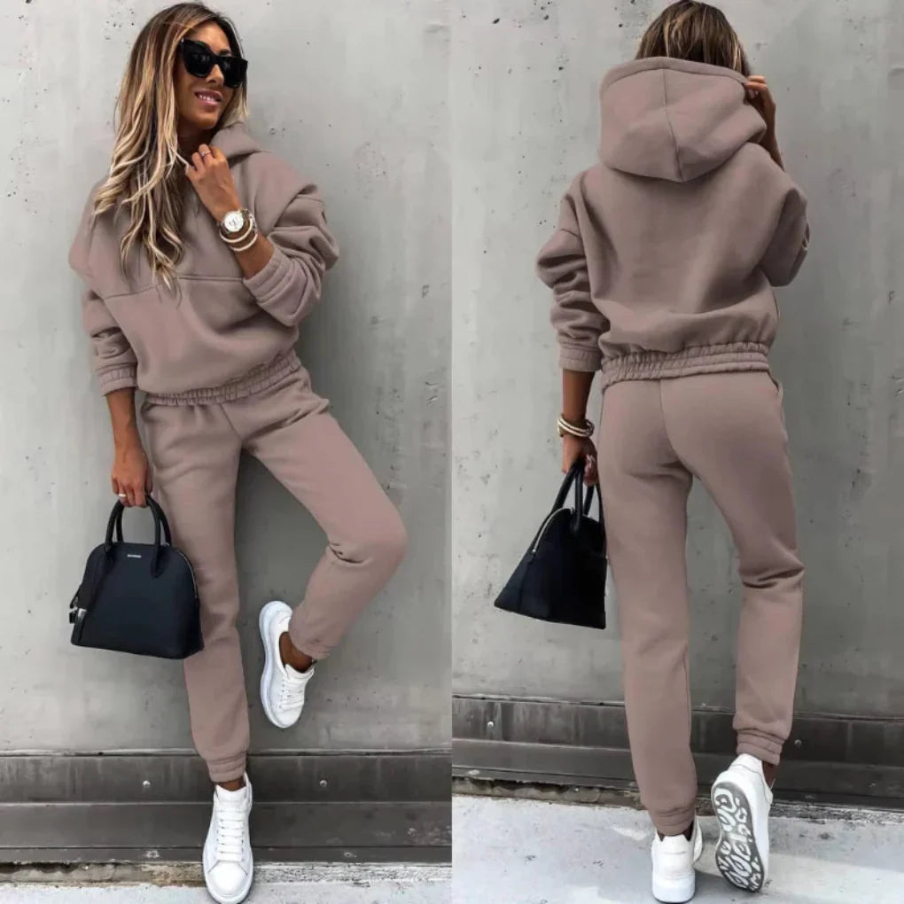 A full shot of a versatile women's two-piece winter tracksuit, blending warmth, comfort, and modern style.