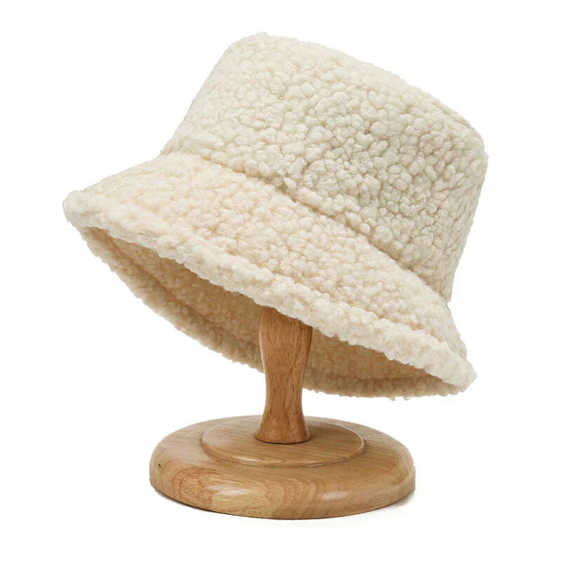 Warm & trendy women's teddy bucket hat. Plush, fashionable winter accessory for cozy cold weather style.