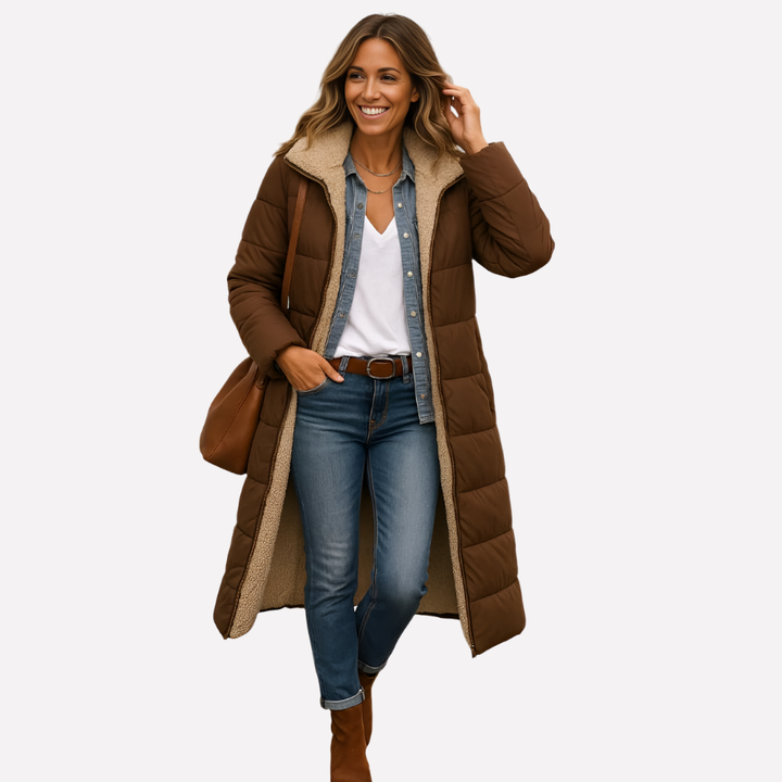 Cozy women's long hooded quilted coat in gray, providing warm outerwear for cold winter & fall days.