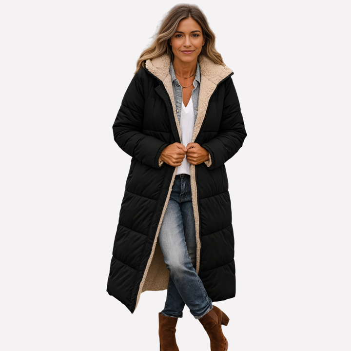 Stylish women's quilted long coat, hooded for extra warmth. Perfect daily layering piece for winter fashion.