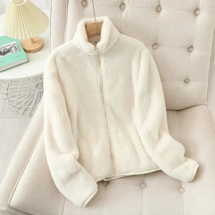 Comfortable women's jacket for layering, warm and cozy winter outerwear. Features a durable zipper.