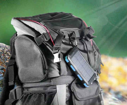 Waterproof 500000mAh solar power bank with dual USB ports, rugged design, ideal for outdoor use and charging devices on the g