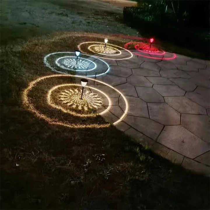 Weatherproof garden light casting intricate mandala shadows, solar-powered, LED, IP65 waterproof, enhances outdoor decor.
