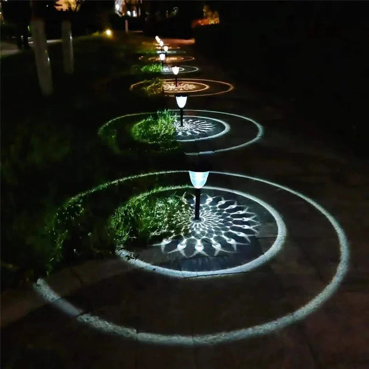 Weatherproof garden light casting intricate mandala shadows, solar-powered, LED, IP65 waterproof, enhances outdoor decor.