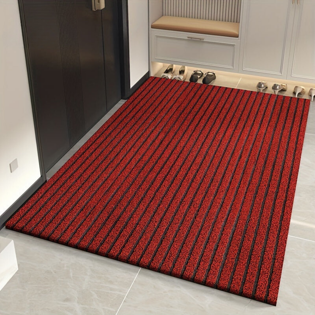 "Weatherproof non-slip outdoor rug with black and grey stripes, ideal for entrances and hallways, enhances safety and style."