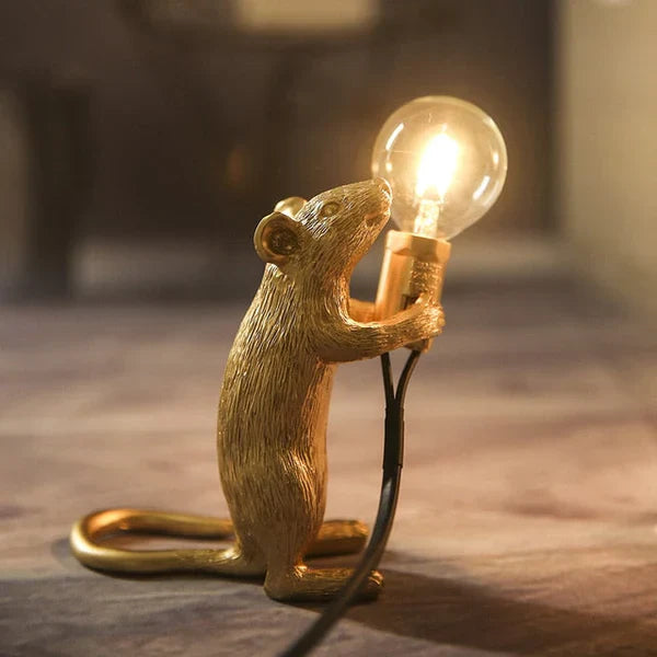 Glowing Whimsical SqueakLight mouse lamp. Decorative animal accent light illuminating modern home.