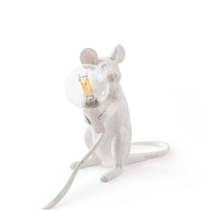 Gold resin SqueakLight mouse lamp, a unique decorative table light. Whimsical animal accent for home.