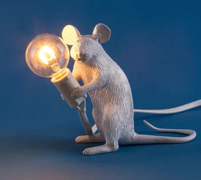 Whimsical resin mouse lamp. Charming animal table light, perfect accent for modern home decor.