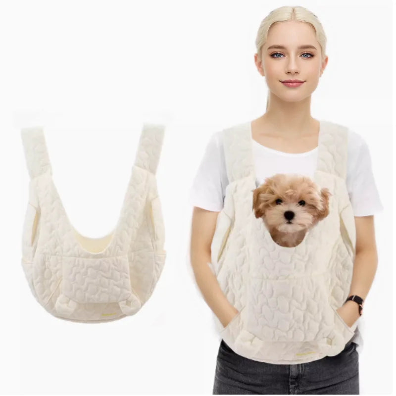 White comfortable pet carrier sling for small dogs with breathable mesh and hands-free design. Features a convenient storage pocket.