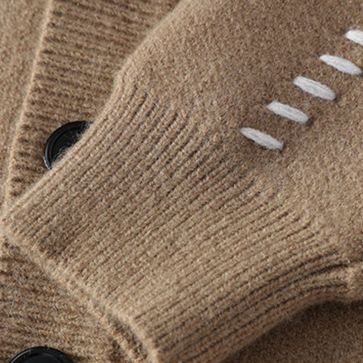 "White men's wool cardigan sweater with button-up front, ribbed cuffs, and black stitch detail for stylish winter wear."