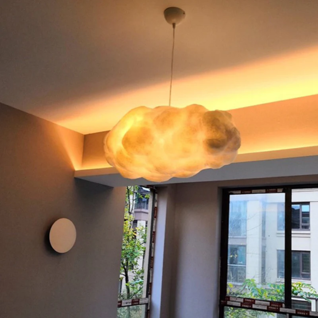 Fluffy white cloud-shaped LED pendant light. Modern PVC & cotton lamp for a dreamy room ambiance.