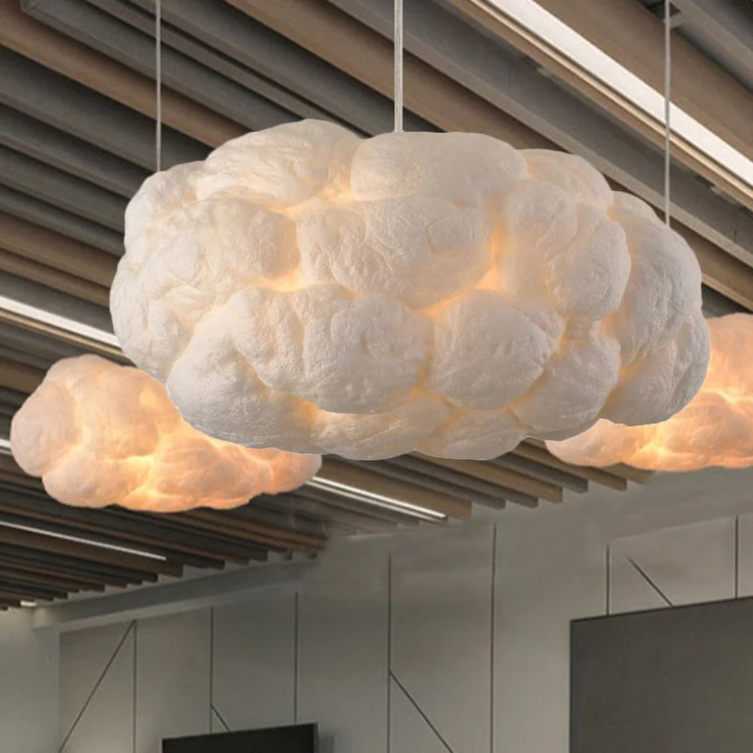 Modern white PVC/cotton cloud LED pendant light providing soft illumination for dining spaces.