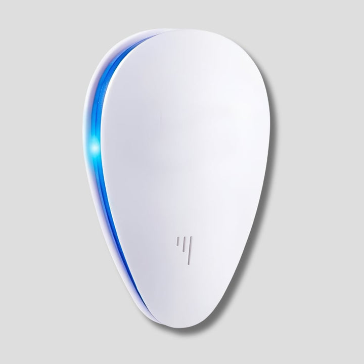 White ultrasonic pest repeller device plugged into outlet, providing chemical-free insect & rodent control for home.