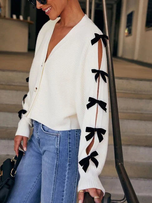 Stylish women's bow sleeve cardigan, a versatile white fashion top for elegant casual wear and comfortable layering.