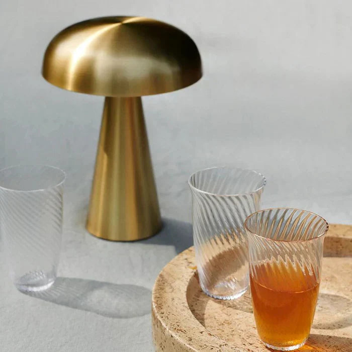 Stylish portable LED mushroom lamp, wireless & dimmable, adds modern ambiance to any room decor.