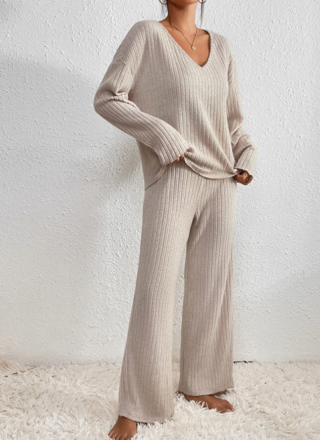 Woman wearing a cozy knit 2-piece lounge set. Elegant casual women's loungewear, perfect matching set.