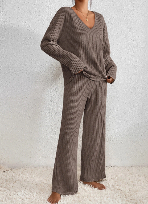 Side view of woman in comfortable knit 2-piece lounge set. Versatile women's loungewear, perfect for cozy fashion.